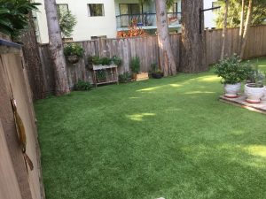 artificial grass back yard in town house complex