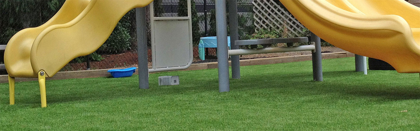 school playground for children featuring artificial grass