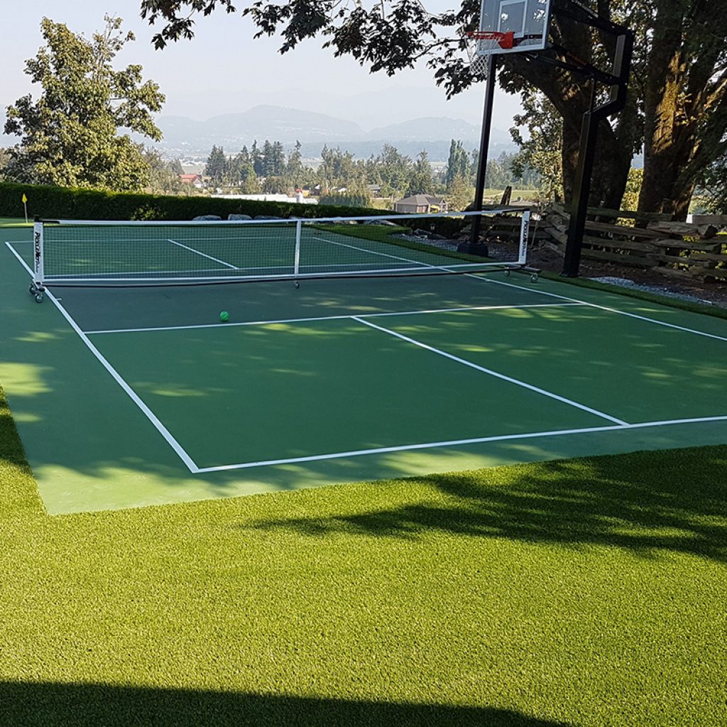 Artificial Grass used for landscape purposes around edge of tennis sports court
